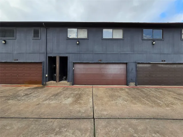 a front view of a house with a garage