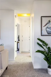 a bedroom with a large bed and a large window