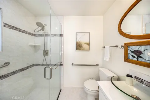 a bathroom with a window and a shower