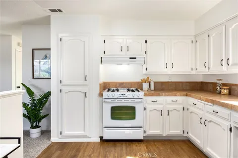 a living room with furniture a window and a fireplace