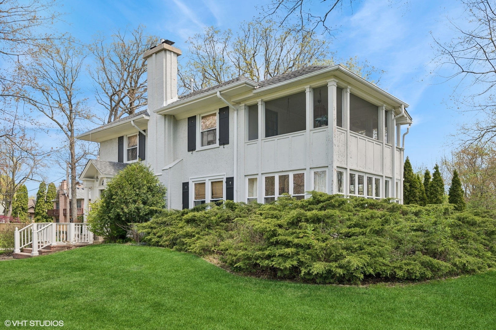 1417 Green Bay Road Highland Park, IL 60035 - Photo 6 of 7 a front view of a house with a garden
