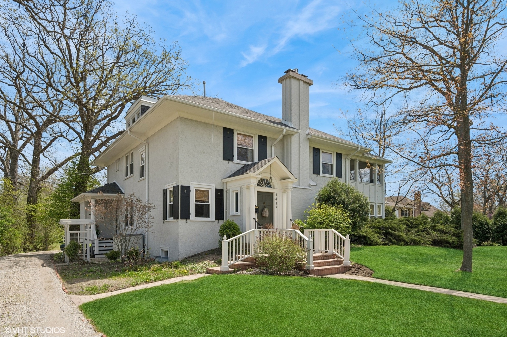 1417 Green Bay Road Highland Park, IL 60035 - Photo 7 of 7 a front view of a house with a garden