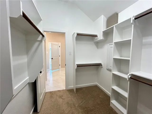 a view of an empty walk in closet