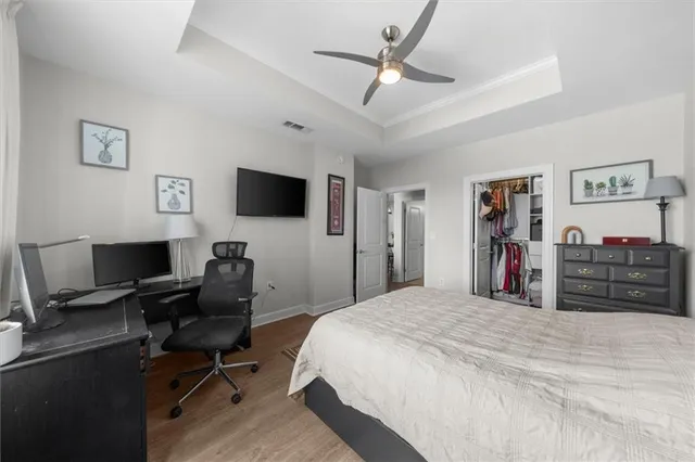 a bed room with a bed and a flat screen tv