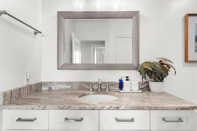 a bathroom with sink and mirror