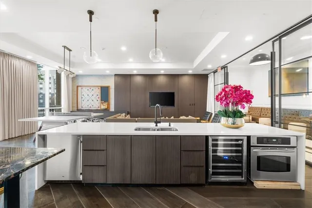 a kitchen with stainless steel appliances granite countertop a sink and cabinets