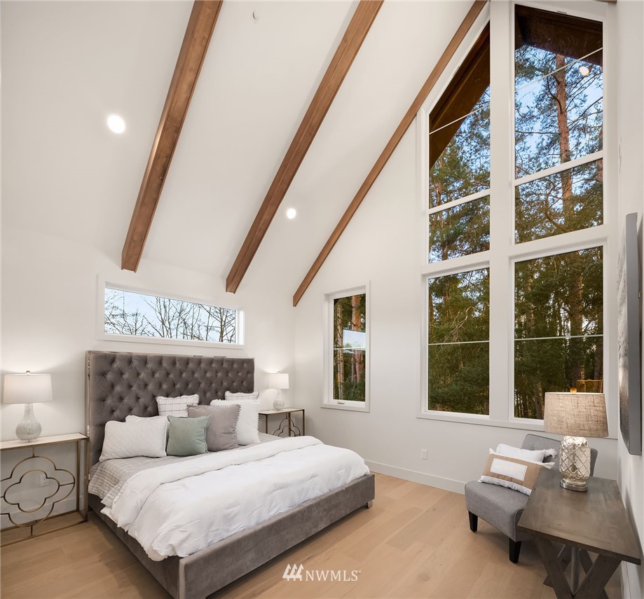 23517 7th Avenue Southeast Bothell, WA 98021 - Photo 12 of 32 a bedroom with a large bed and a large window