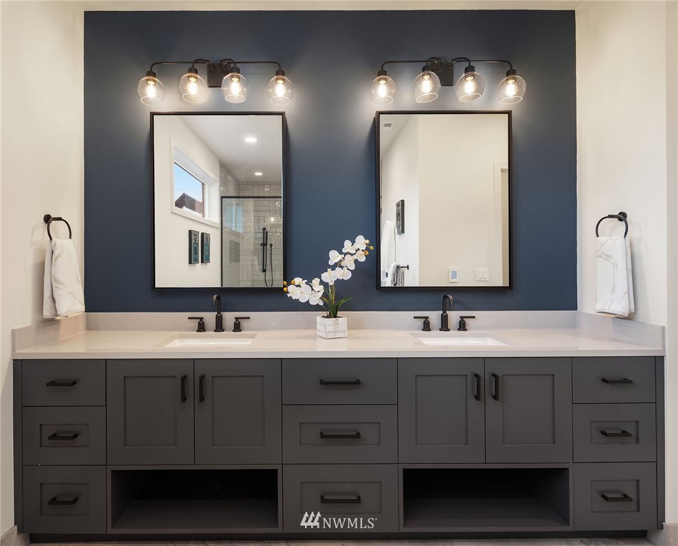 23517 7th Avenue Southeast Bothell, WA 98021 - Photo 13 of 32 a bathroom with double vanity sinks and a mirror