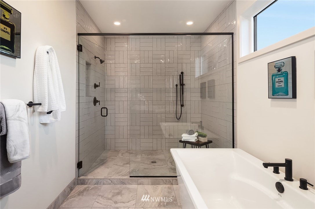 23517 7th Avenue Southeast Bothell, WA 98021 - Photo 14 of 32 a bathroom with a tub shower sink and a shower