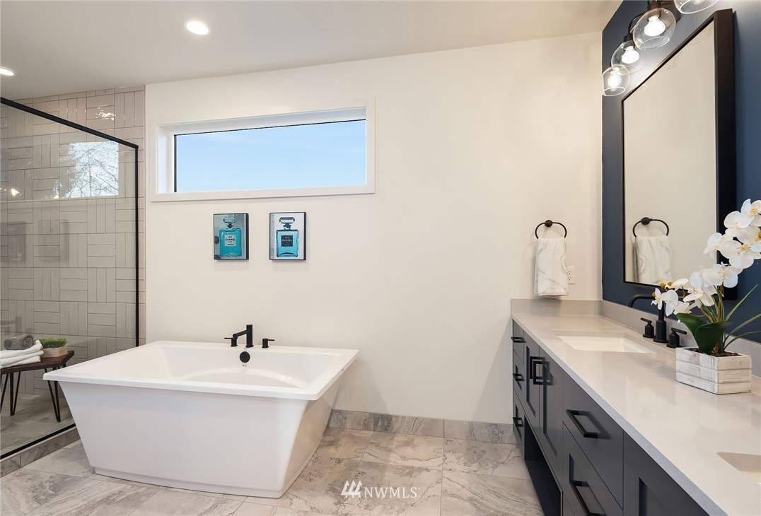 23517 7th Avenue Southeast Bothell, WA 98021 - Photo 15 of 32 a bathroom with a sink and a mirror