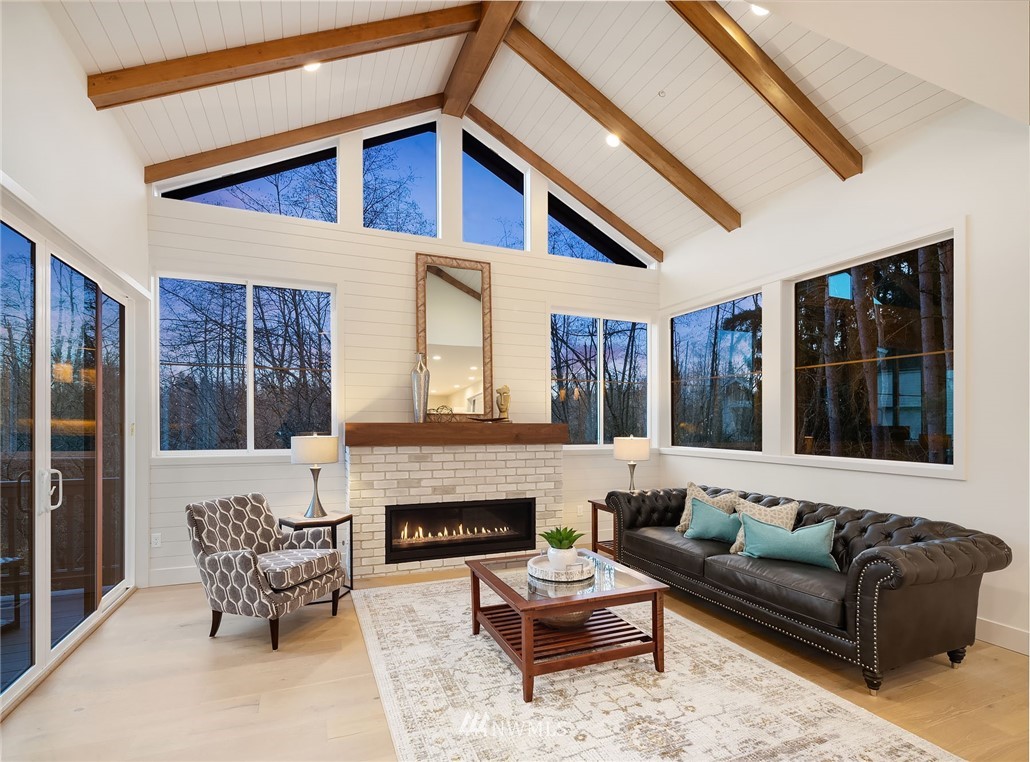 23517 7th Avenue Southeast Bothell, WA 98021 - Photo 3 of 32 a balcony with furniture and a fireplace