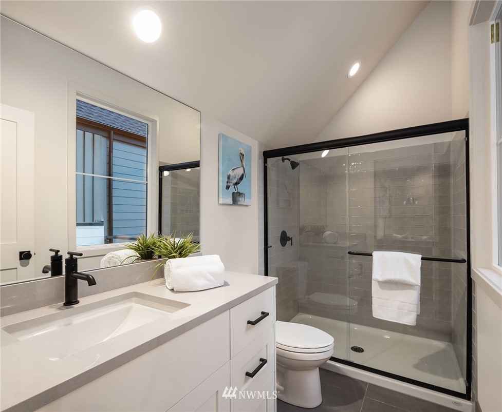 23517 7th Avenue Southeast Bothell, WA 98021 - Photo 30 of 32 a bathroom with a granite countertop sink toilet and shower