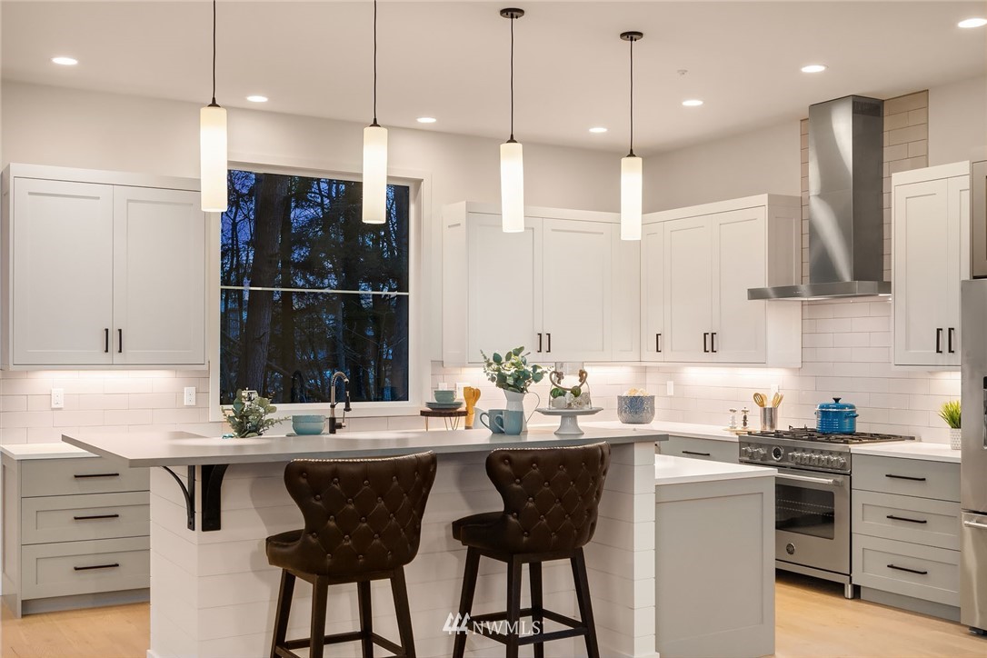 23517 7th Avenue Southeast Bothell, WA 98021 - Photo 10 of 32 a kitchen with a sink cabinets and window