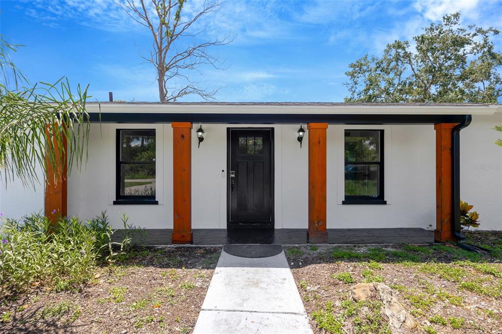 9935 River Drive Gibsonton, FL 33534 - Photo 2 of 29 a front view of house with yard