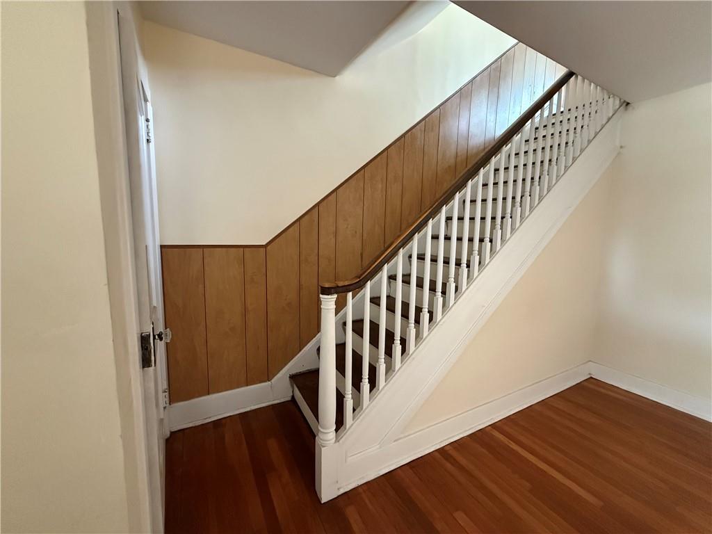 2332 Sherbrook Street Pittsburgh, PA 15217 - Photo 21 of 40 a view of staircase with wooden floor and white walls