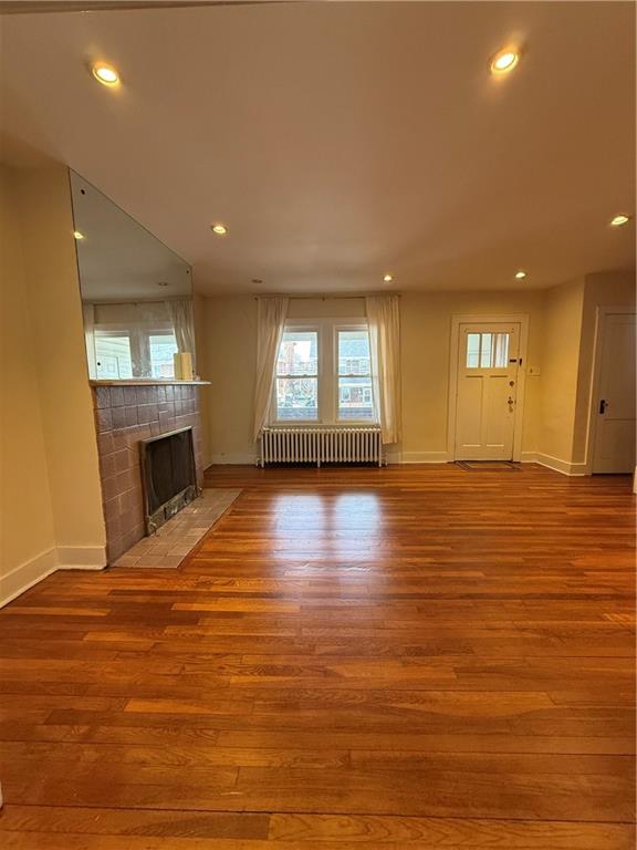 2332 Sherbrook Street Pittsburgh, PA 15217 - Photo 23 of 40 an empty room with wooden floor and fireplace