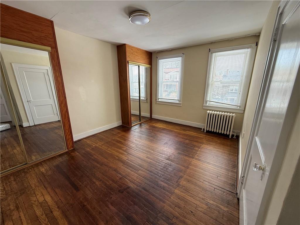 2332 Sherbrook Street Pittsburgh, PA 15217 - Photo 3 of 40 a view of an empty room with wooden floor and a window