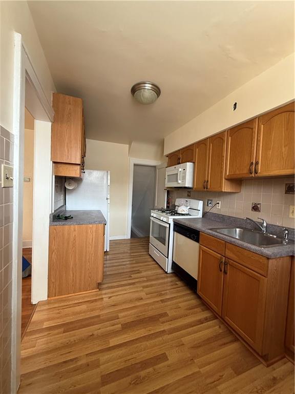2332 Sherbrook Street Pittsburgh, PA 15217 - Photo 33 of 40 a kitchen with granite countertop a stove and cabinets