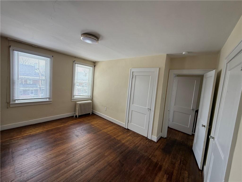 2332 Sherbrook Street Pittsburgh, PA 15217 - Photo 4 of 40 an empty room with wooden floor and windows