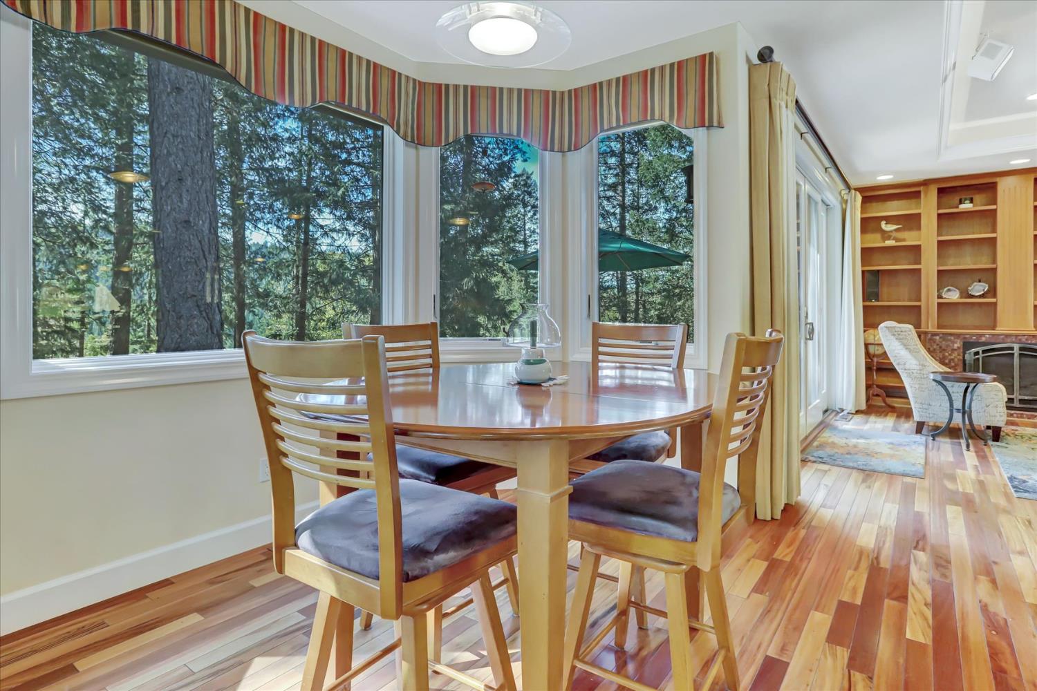 10973 Scotts Flat Dam Road Nevada City, CA 95959 - Photo 15 of 91 a view of a dining room with furniture window and outside view