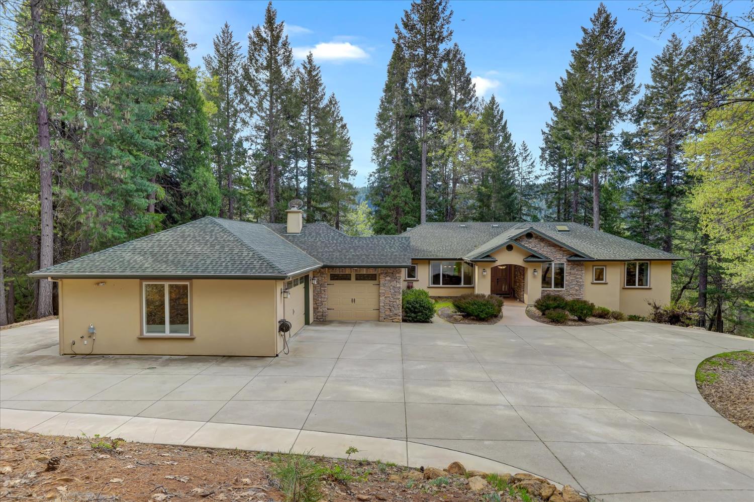 10973 Scotts Flat Dam Road Nevada City, CA 95959 - Photo 2 of 91 a view of a house with a yard and large trees
