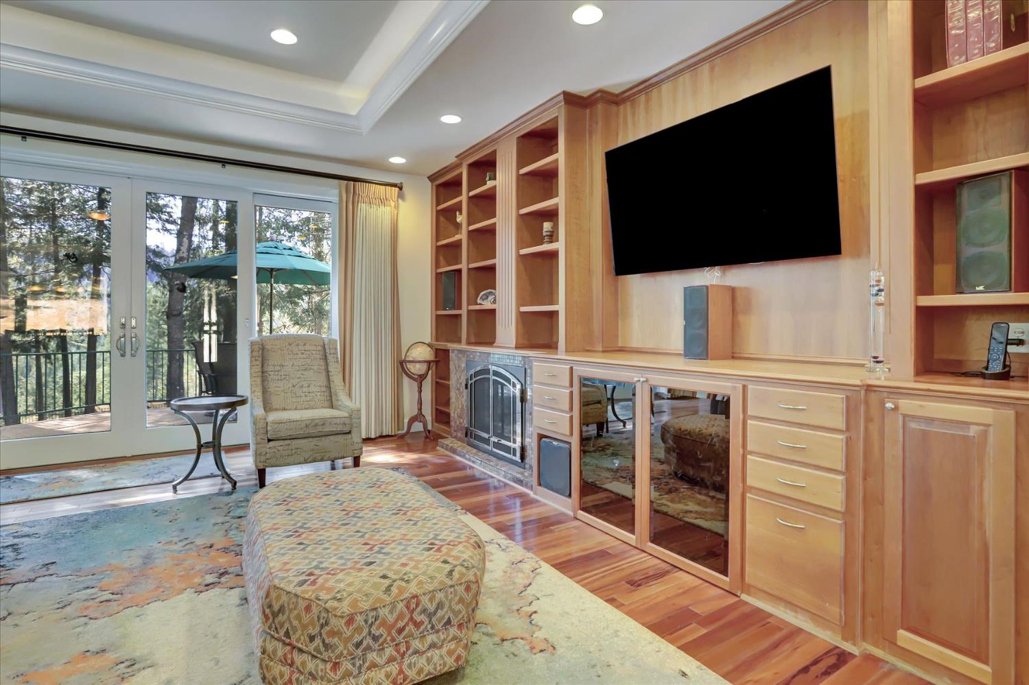 10973 Scotts Flat Dam Road Nevada City, CA 95959 - Photo 30 of 91 a living room with flat screen tv and a rug
