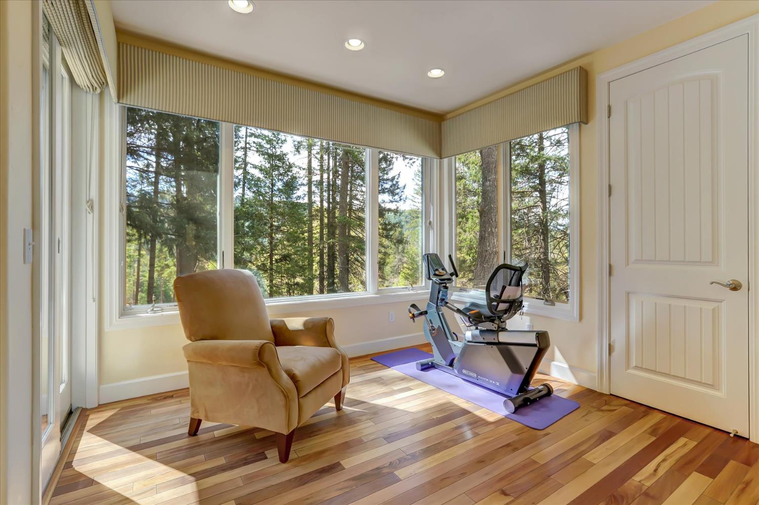 10973 Scotts Flat Dam Road Nevada City, CA 95959 - Photo 36 of 91 a living room with furniture and floor to ceiling windows
