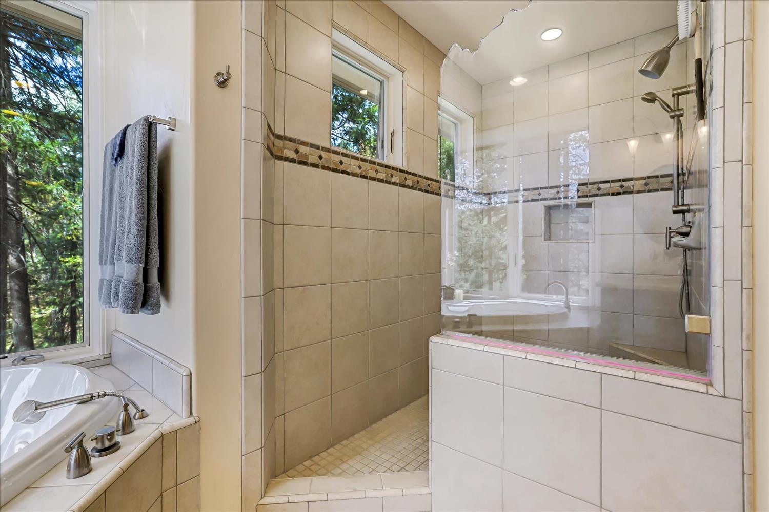 10973 Scotts Flat Dam Road Nevada City, CA 95959 - Photo 40 of 91 a bathroom with a bathtub and a shower
