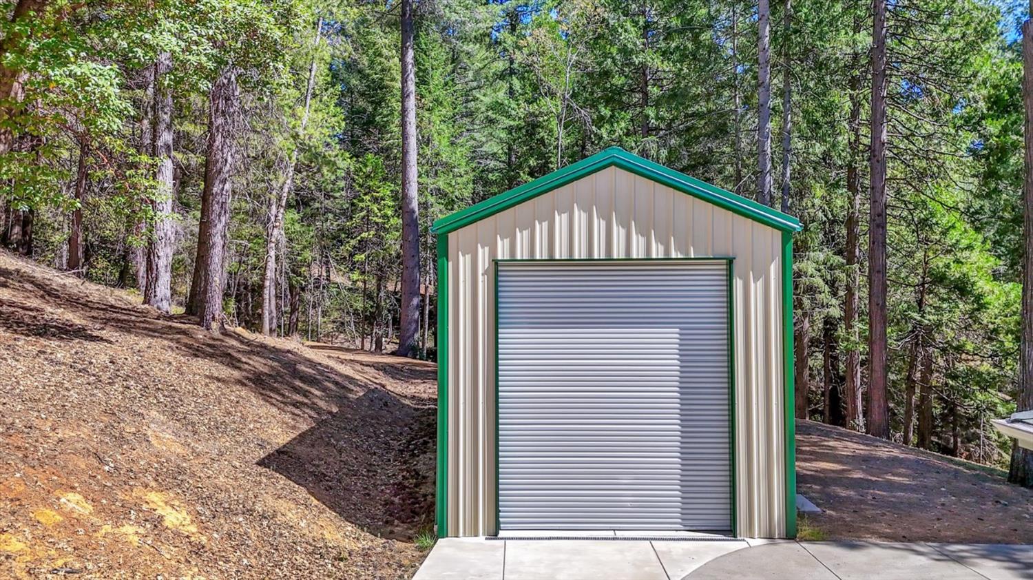 10973 Scotts Flat Dam Road Nevada City, CA 95959 - Photo 77 of 91 a front view of a house with a garden