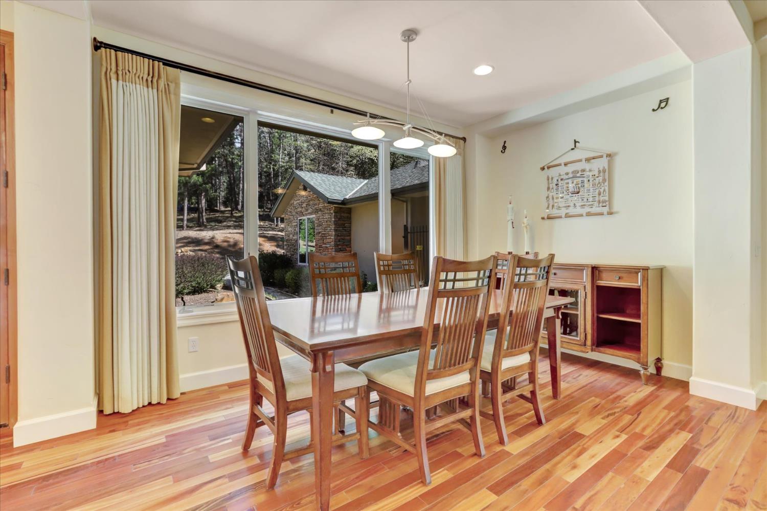 10973 Scotts Flat Dam Road Nevada City, CA 95959 - Photo 8 of 91 a view of a dining room with furniture window and wooden floor