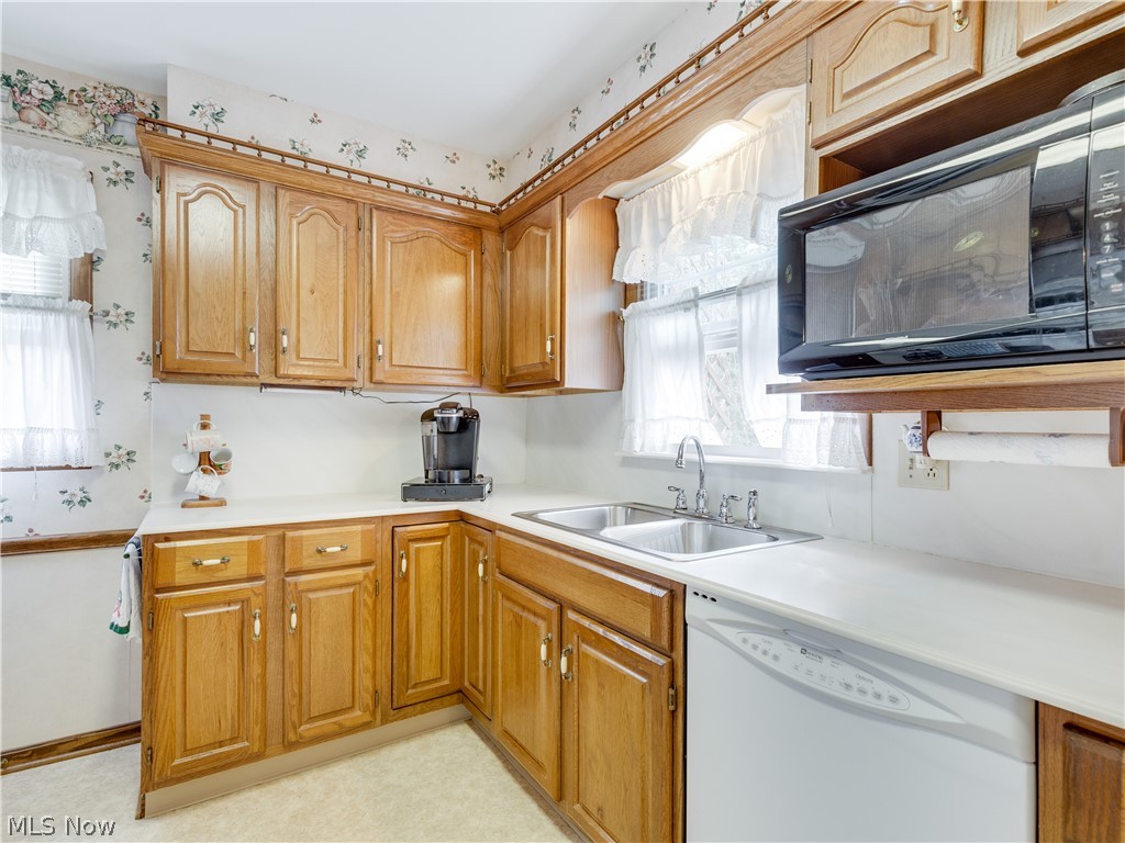 288 Yager Road Clinton, OH 44216 - Photo 14 of 27 Kitchen has ample cabinets and double sink