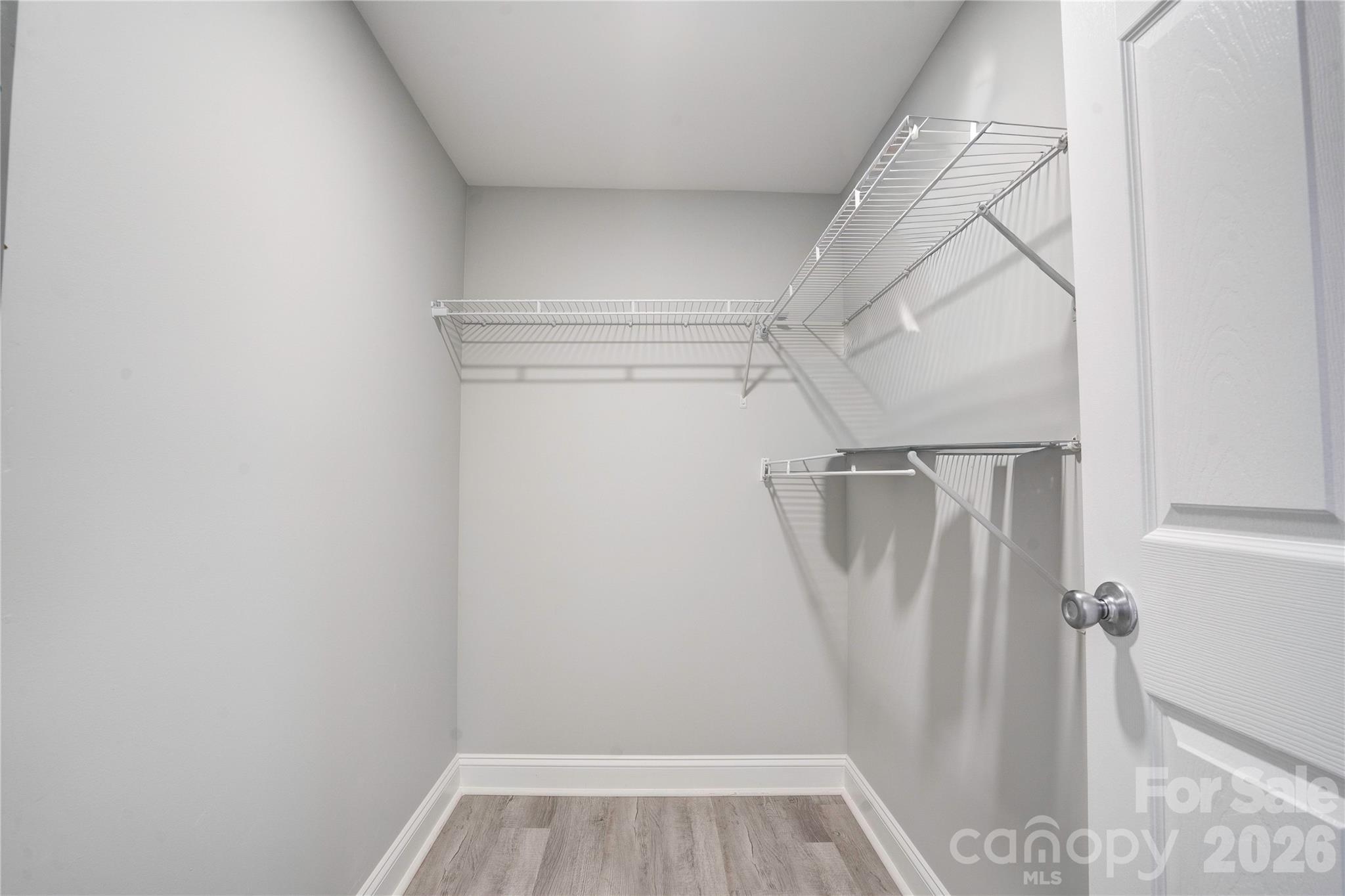 2822 Bettis Road Grover, NC 28073 - Photo 27 of 32 a view of walk in closet with empty racks