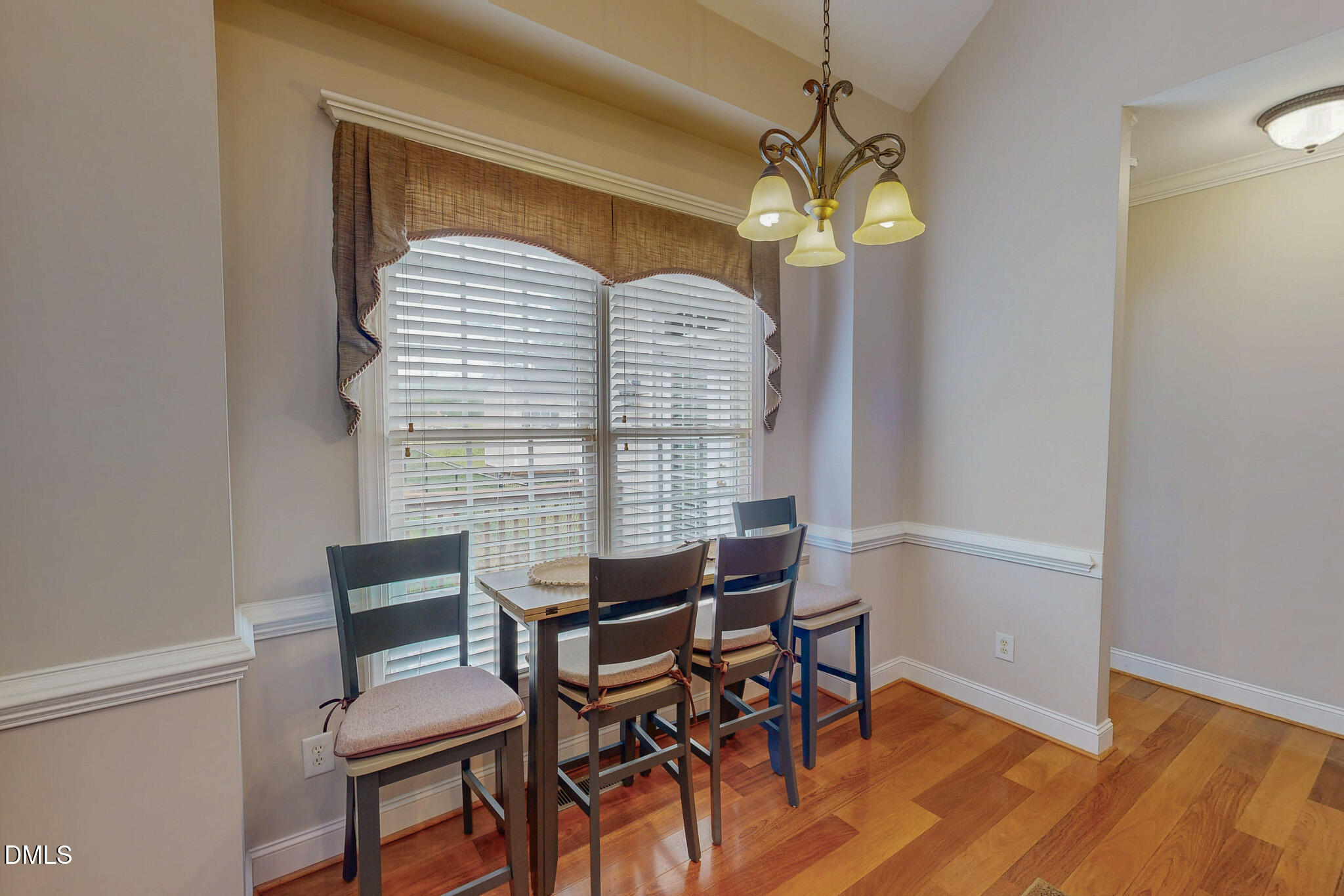 115 Duncan Plantation Road Timberlake, NC 27583 - Photo 30 of 48 a view of a dining room with furniture and wooden floor
