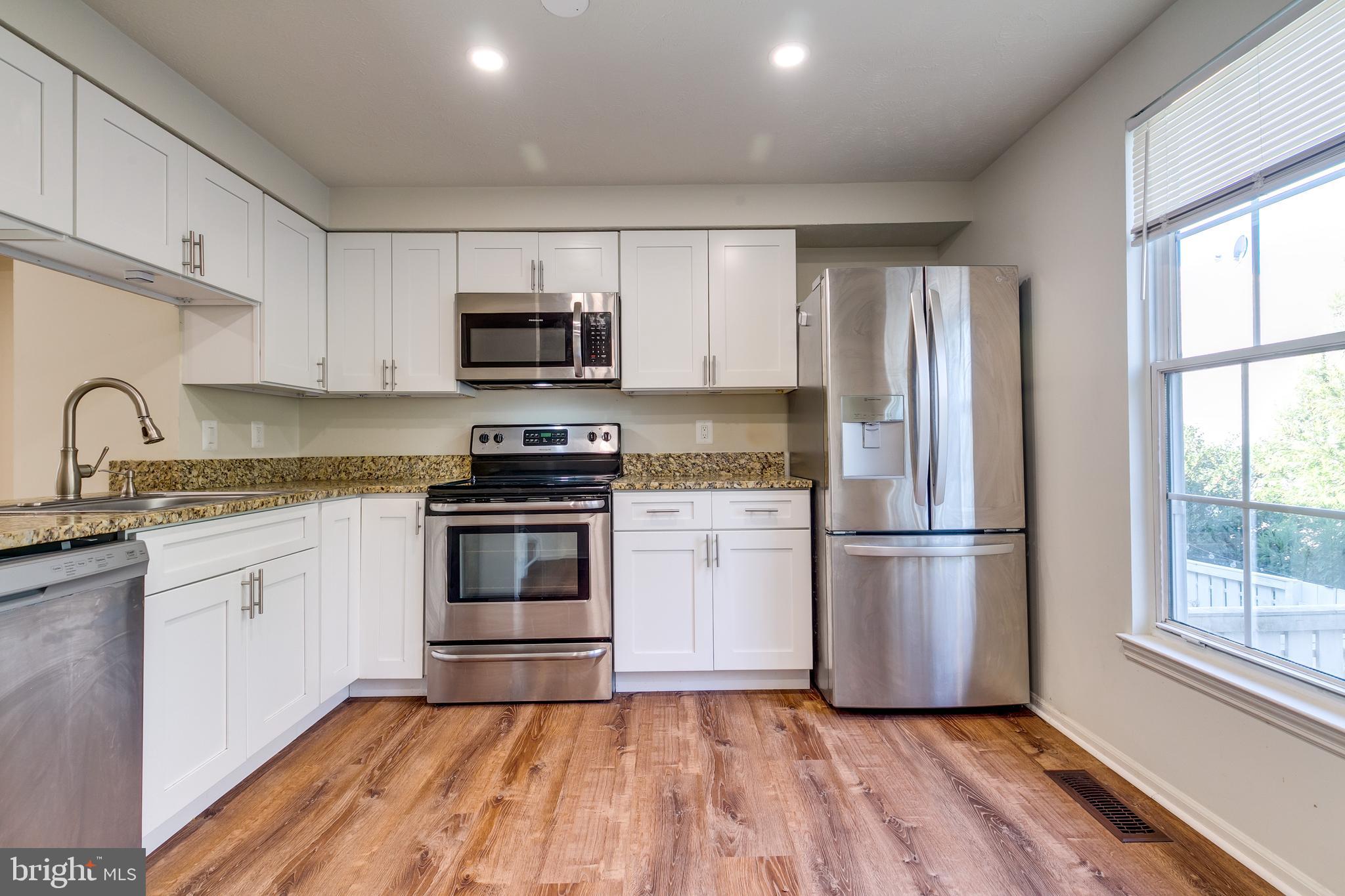 1589 Woodcrest Drive Reston, VA 20194 - Photo 11 of 29 a kitchen with a refrigerator stove and microwave