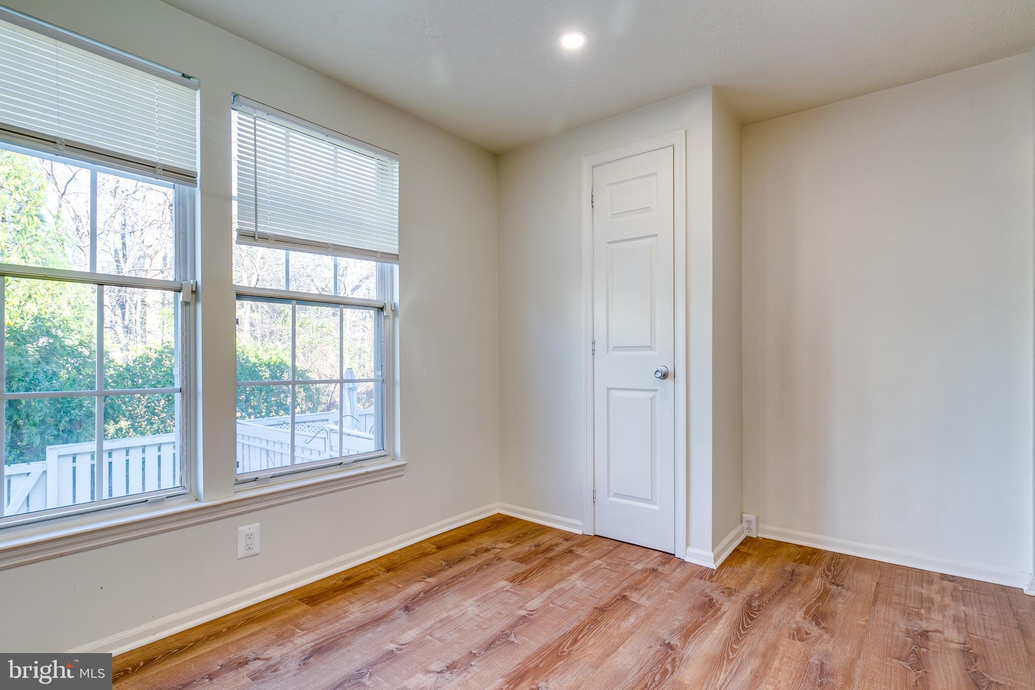 1589 Woodcrest Drive Reston, VA 20194 - Photo 14 of 29 a view of an empty room with wooden floor and a window