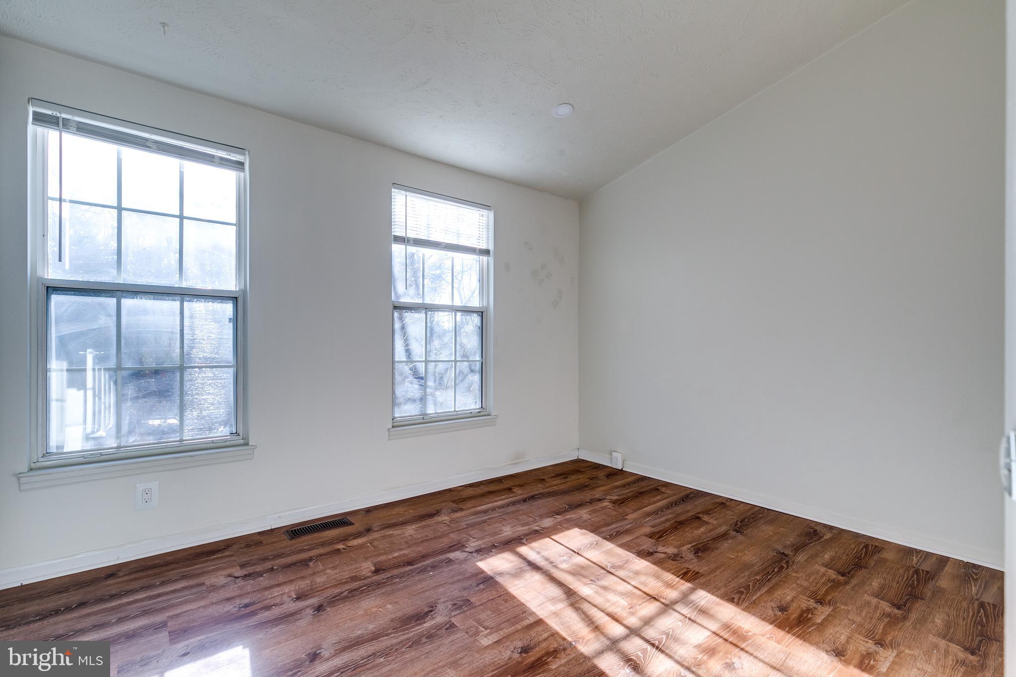 1589 Woodcrest Drive Reston, VA 20194 - Photo 16 of 29 a view of a room with wooden floor and windows