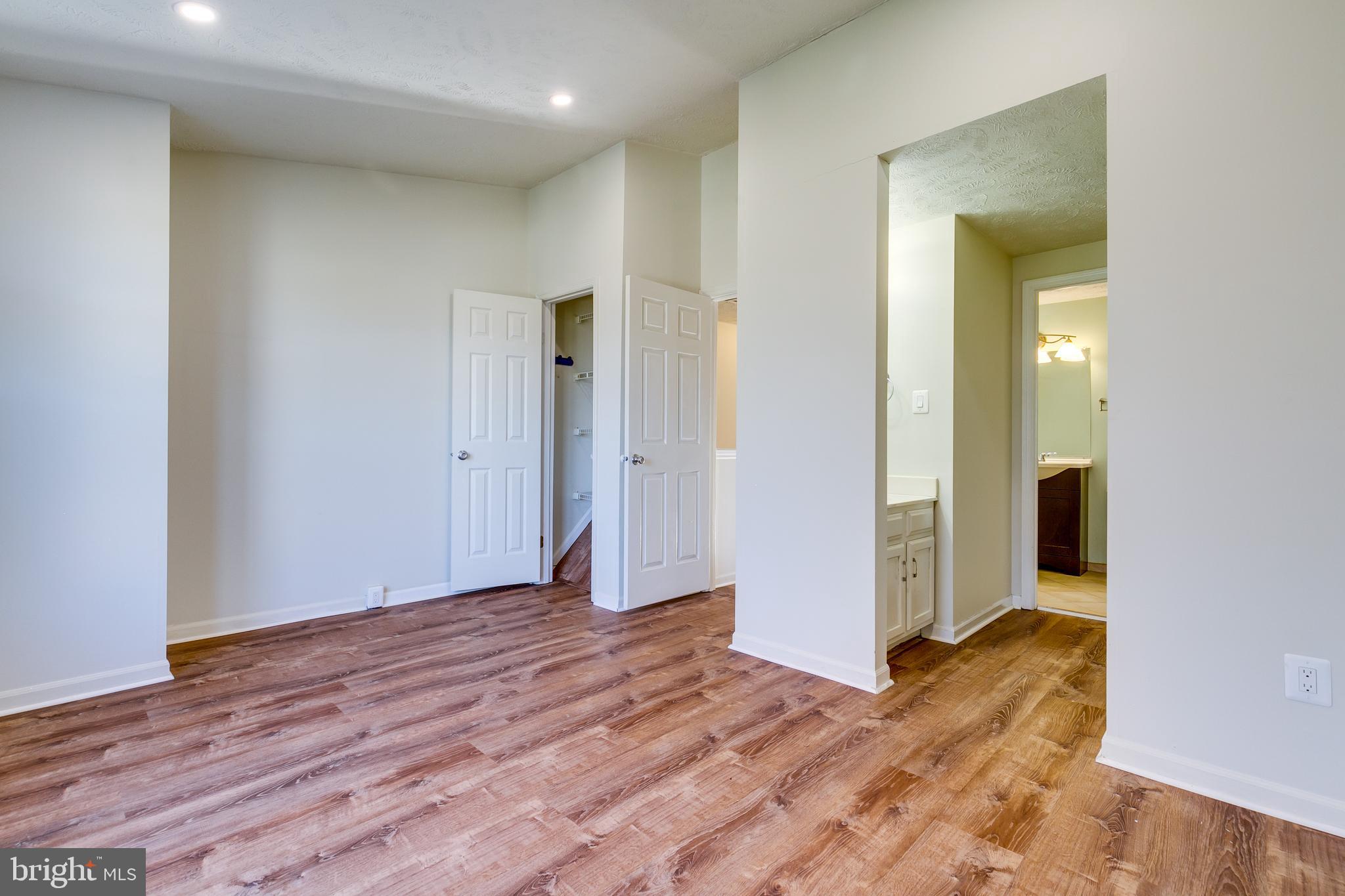 1589 Woodcrest Drive Reston, VA 20194 - Photo 20 of 29 a view of an empty room with wooden floor