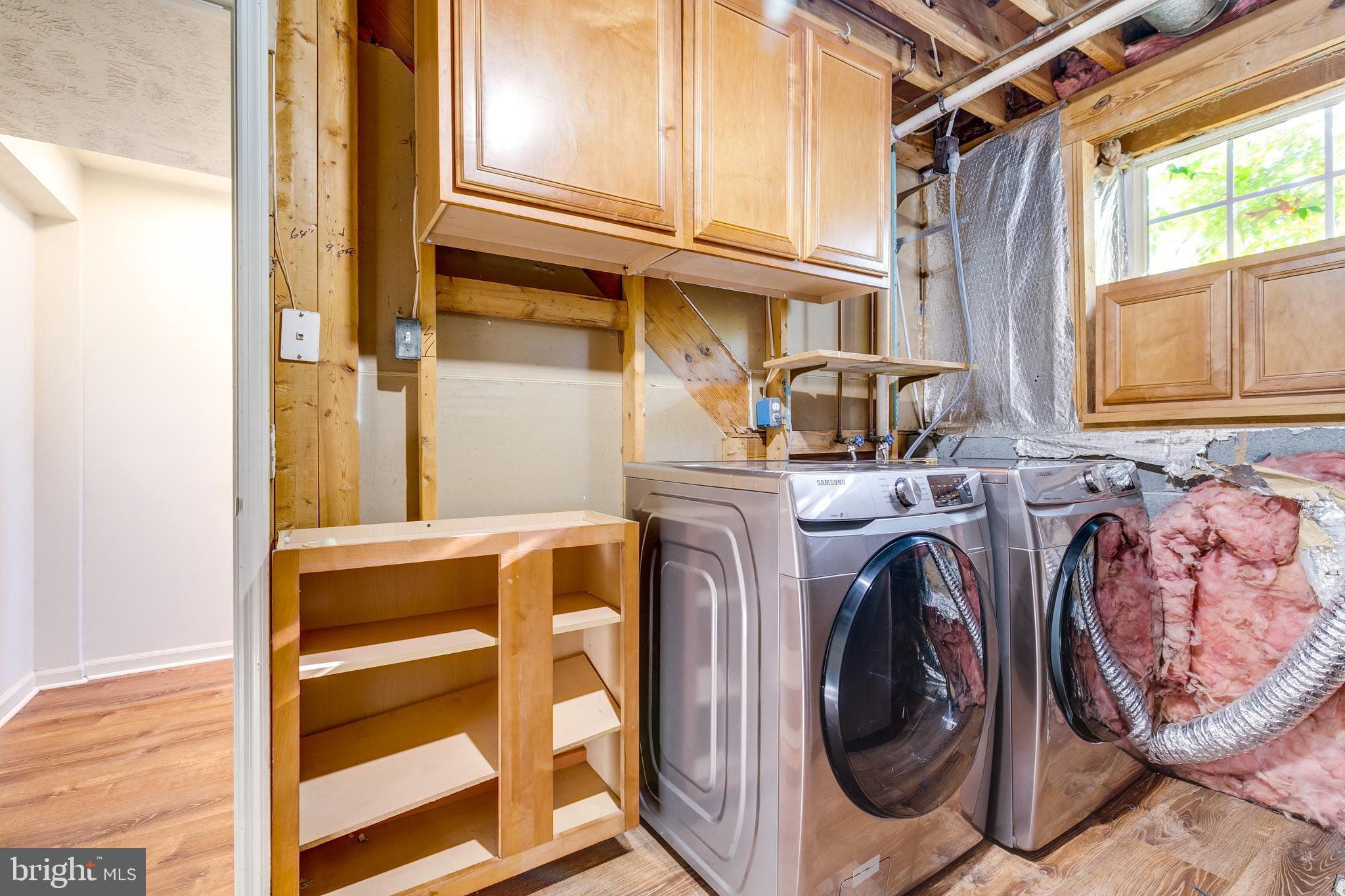1589 Woodcrest Drive Reston, VA 20194 - Photo 29 of 29 a utility room with dryer and washer