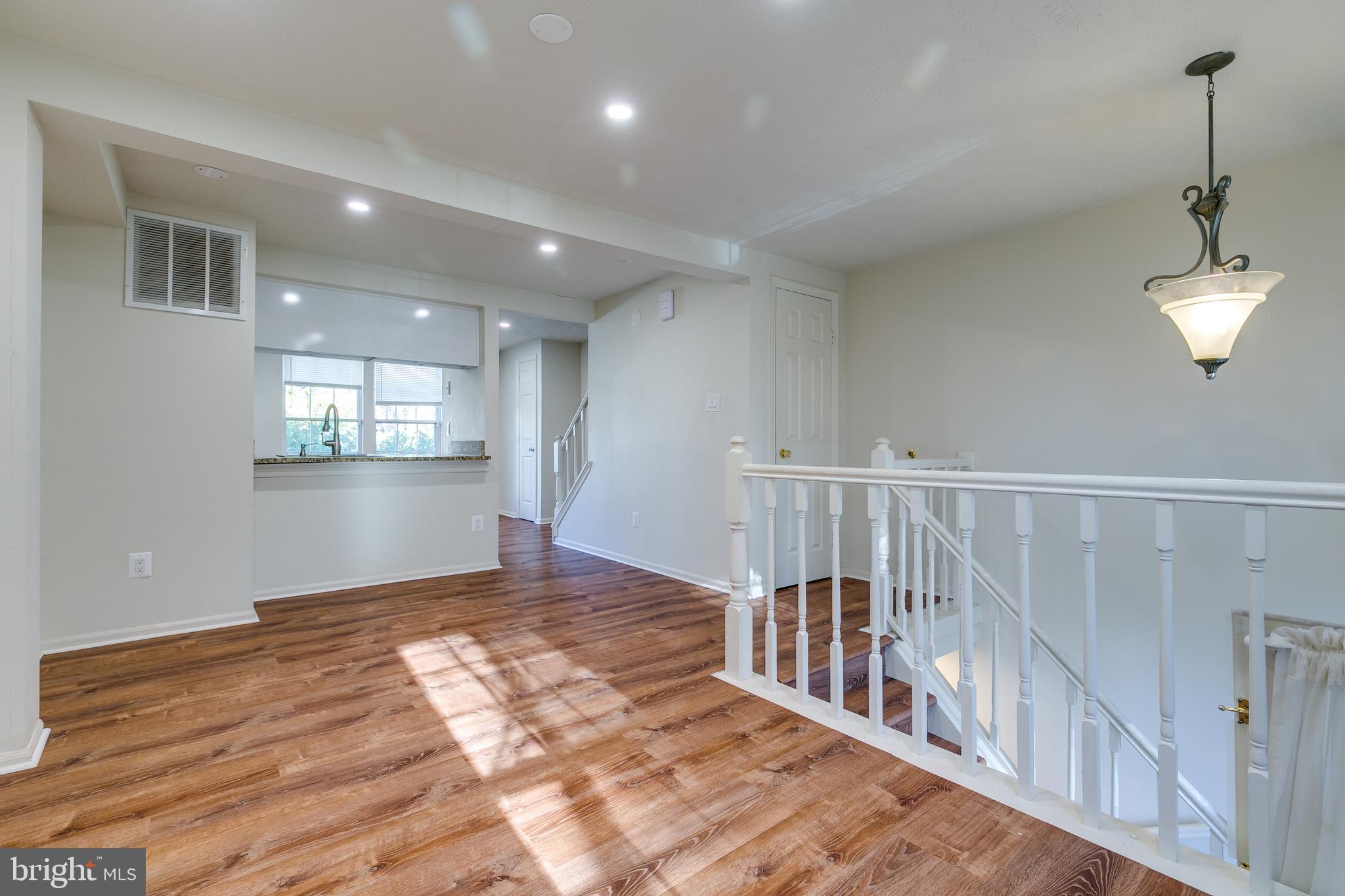 1589 Woodcrest Drive Reston, VA 20194 - Photo 5 of 29 a view of entryway and hall with wooden floor