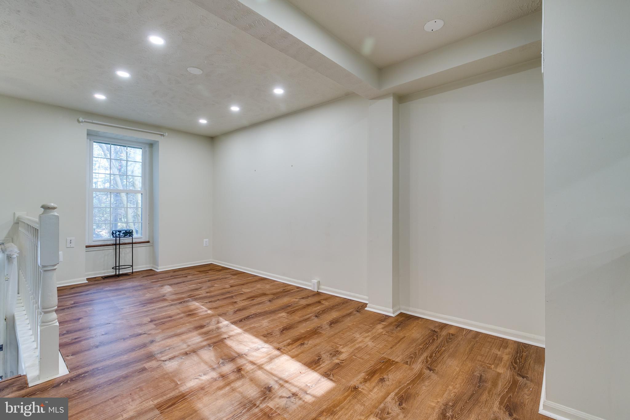 1589 Woodcrest Drive Reston, VA 20194 - Photo 7 of 29 a view of empty room with wooden floor and fan