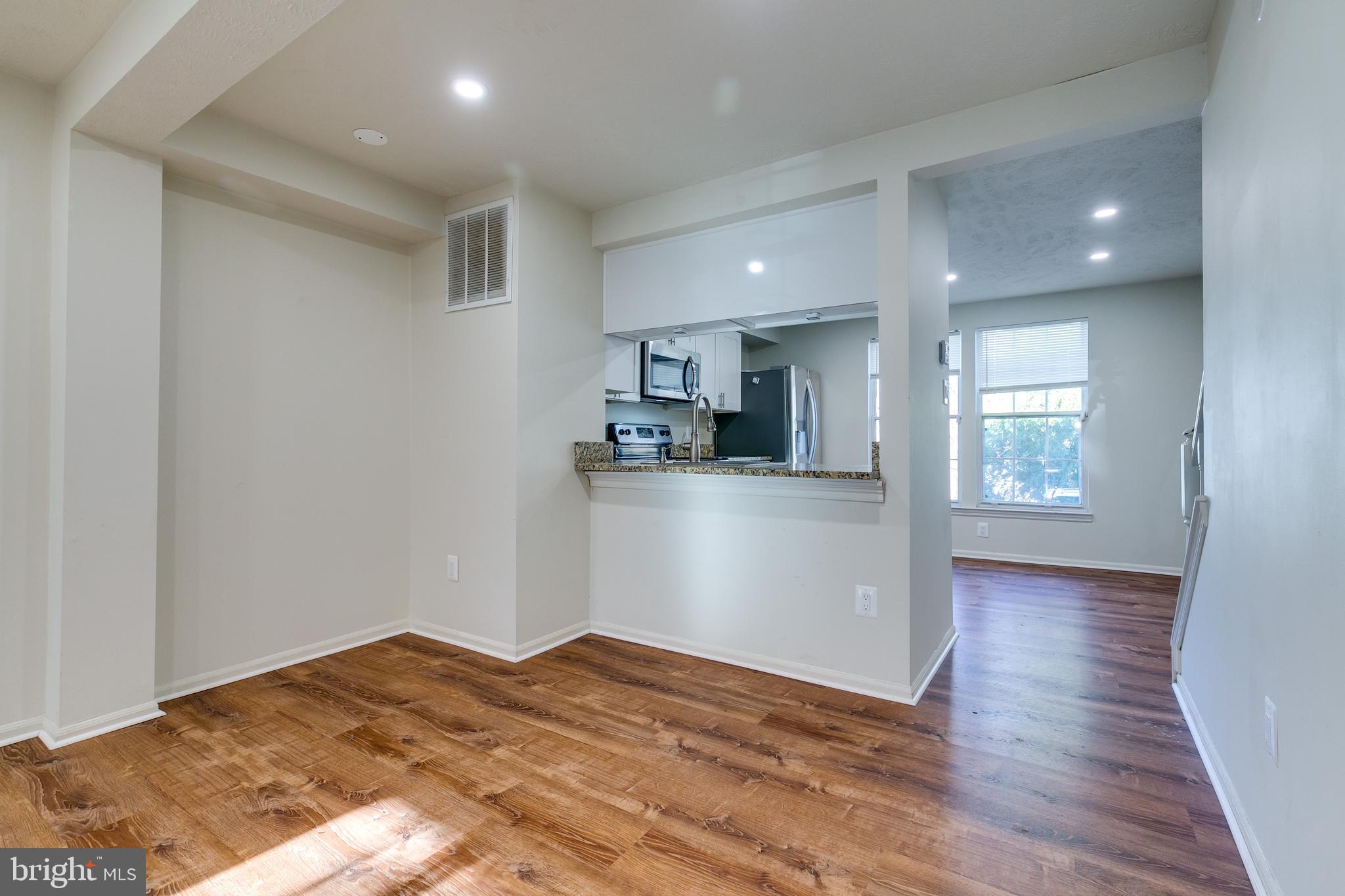 1589 Woodcrest Drive Reston, VA 20194 - Photo 9 of 29 a view of a kitchen cabinets and wooden floor