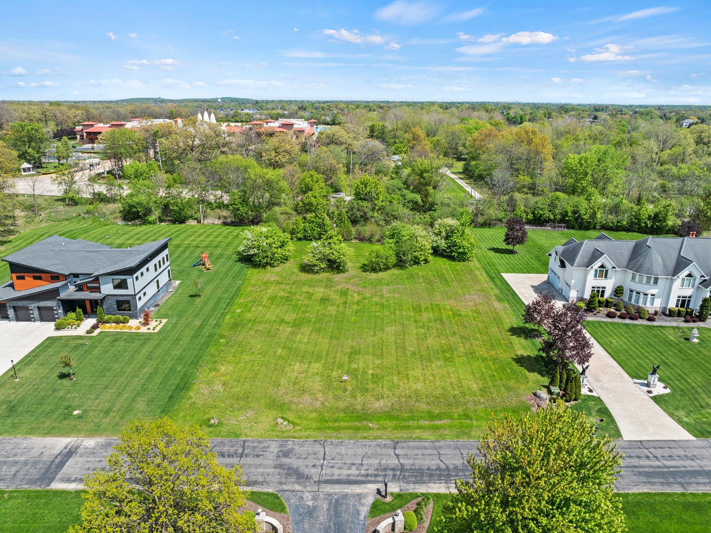 a view of a lake with a yard