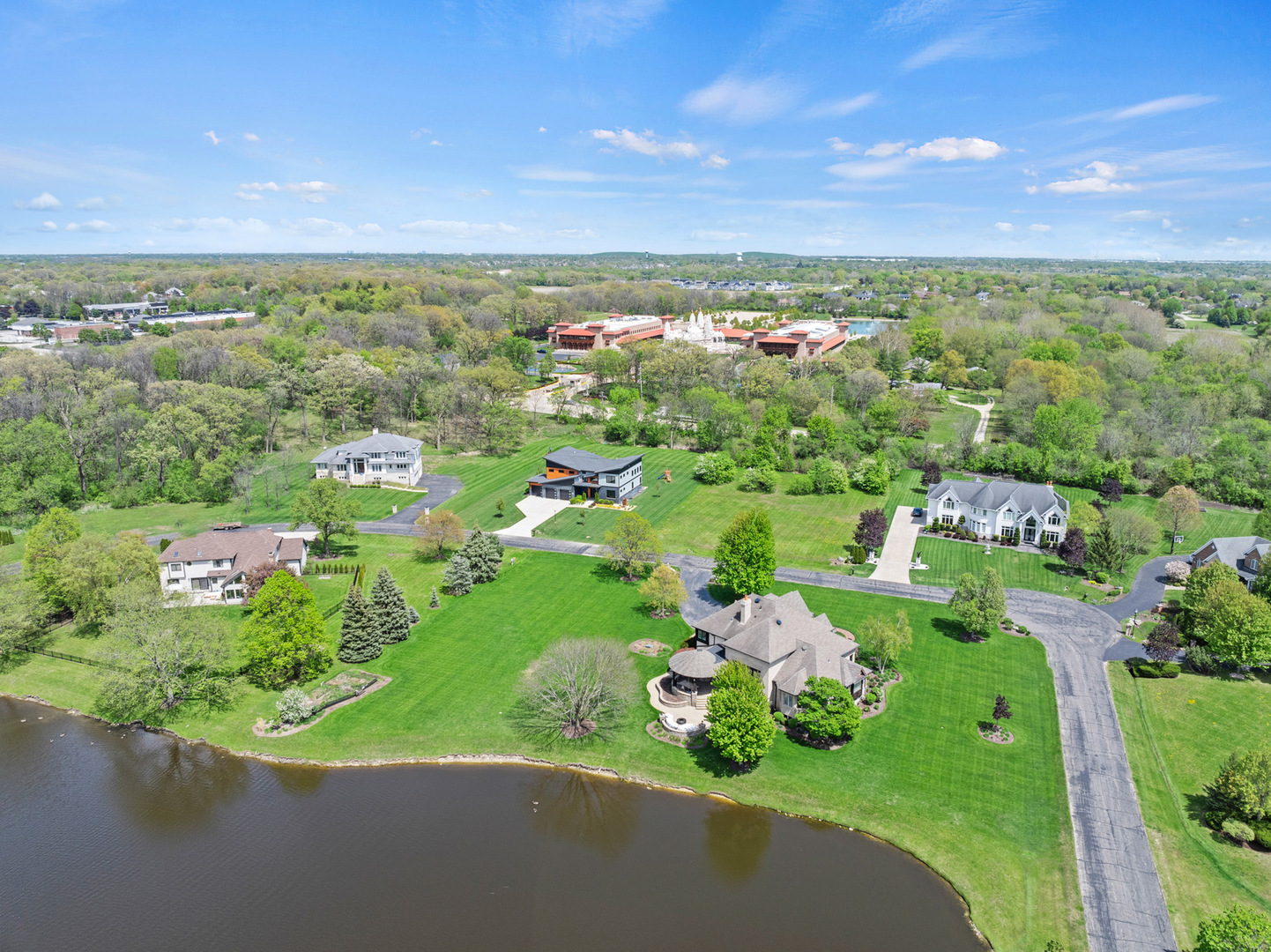 4N707 White Oak Lane Wayne, IL 60184 - Photo 5 of 5 an aerial view of a city with lots of residential buildings ocean and mountain view in back