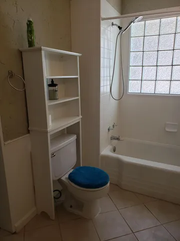 a bathroom with a sink a toilet and a bathtub