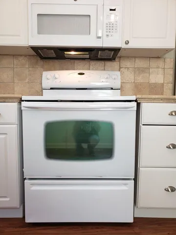 a close view of appliances and cabinets