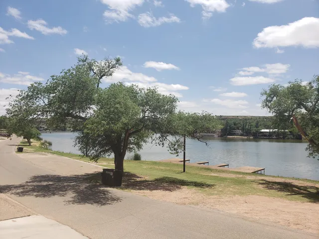 a view of a lake with a yard