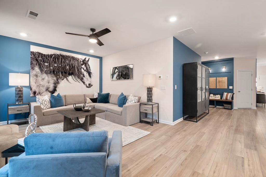 57 Scout Way Newnan, GA 30263 - Photo 17 of 37 a living room with furniture and a large window