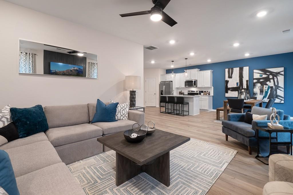 57 Scout Way Newnan, GA 30263 - Photo 20 of 37 a living room with furniture kitchen view and a wooden floor