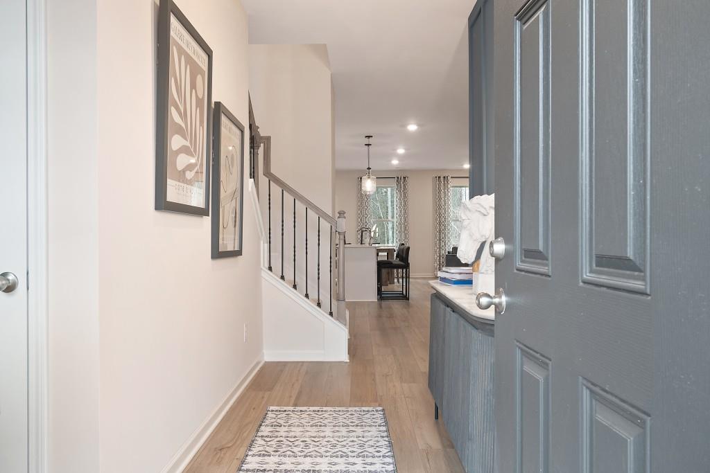57 Scout Way Newnan, GA 30263 - Photo 2 of 37 a hallway with a white stove next to a window