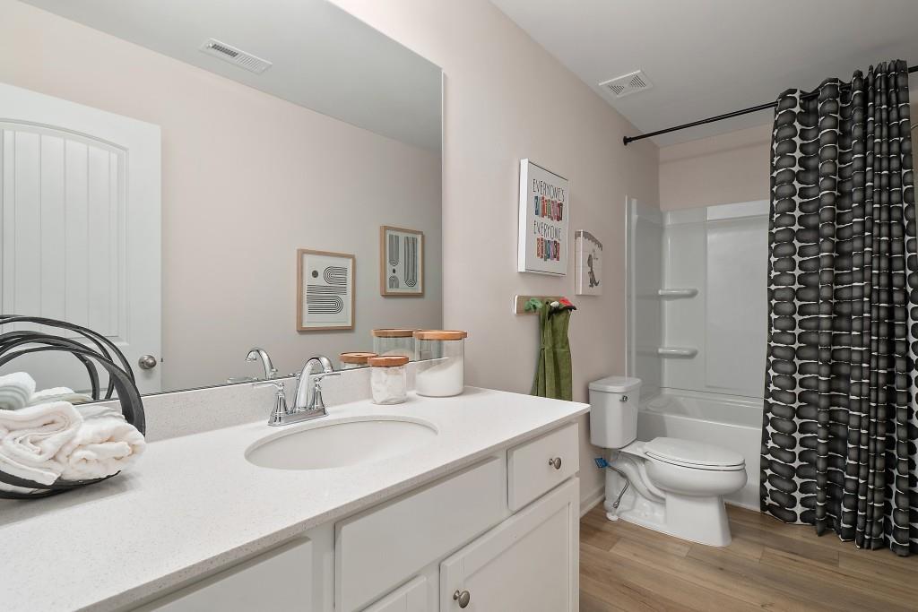 57 Scout Way Newnan, GA 30263 - Photo 27 of 37 a bathroom with a sink toilet and shower